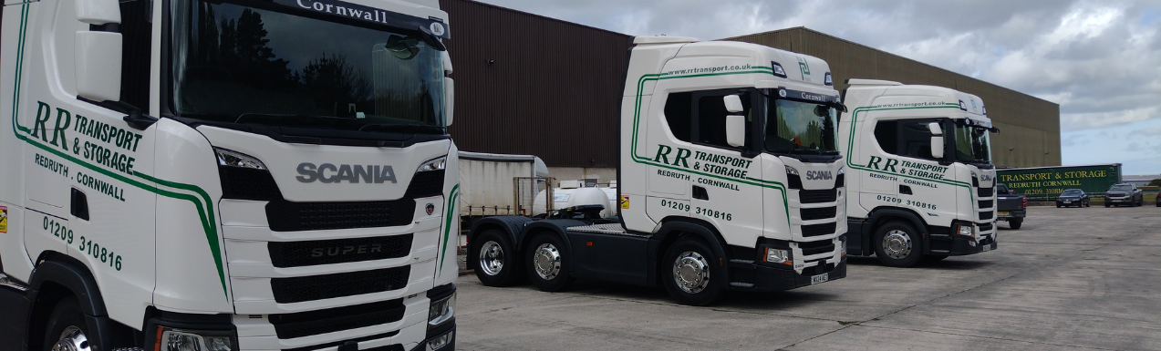 White delivery trucks lined up