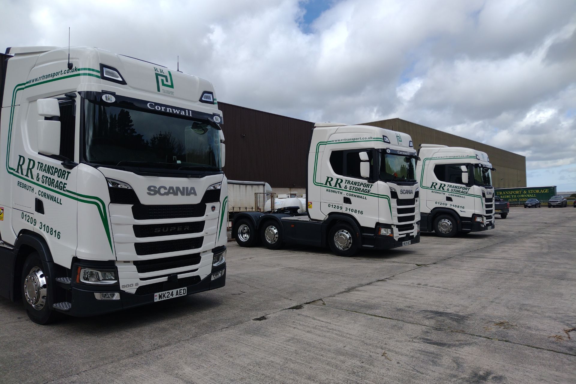 White delivery trucks lined up